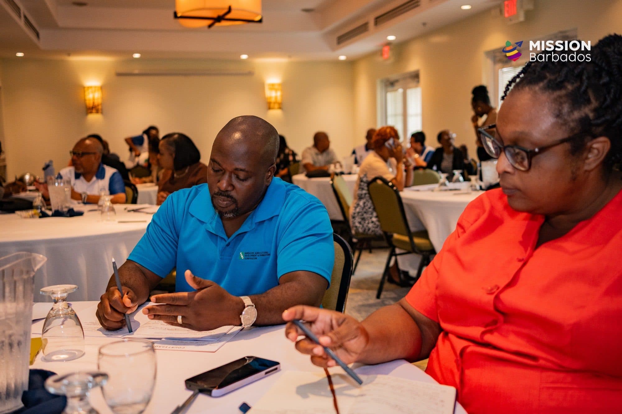 Public officers collaborating at a Mission Barbados Champions Day workshop
